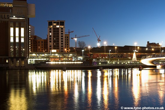 Baltic Centre seen from across the River Tyne as night falls.