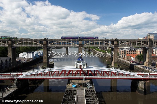 View from the middle of the Tyne Bridge towards the Swing Bridge and High Level Bridge.