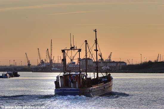 Fishing boat Kinloch sailing up the RiverTyne at sunset.