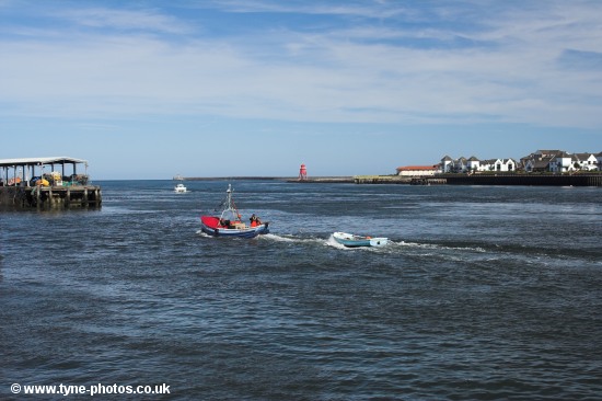 A fishing coble returning to the Fish Quay.