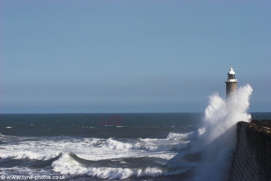 Waves breaking over Tynemouth Pier.