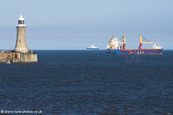 Cargo Ship BBC England passing Tynemouth Pier and Lighthouse and turning south.