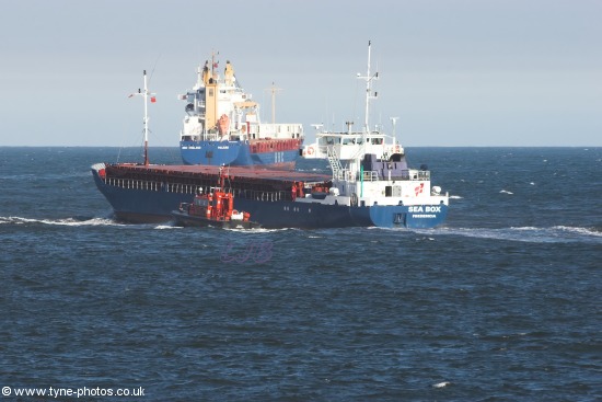 Tyne Pilot Boat Bewick escorting the cargo ship Sea Box out of the River Tyne.
