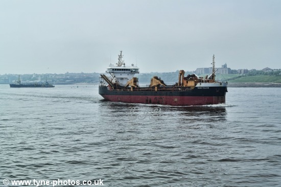 Dredger Sand Falcon leaving the River Tyne, past Tynemouth Pier.