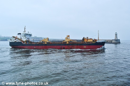 Dredger Sand Falcon leaving the River Tyne, past Tynemouth Pier.