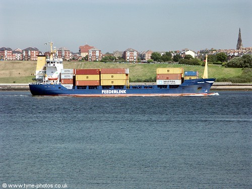 A container ship sailing out of the River Tyne.