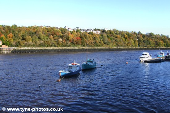 Boats moored on the River Tyne at Felling Shore .