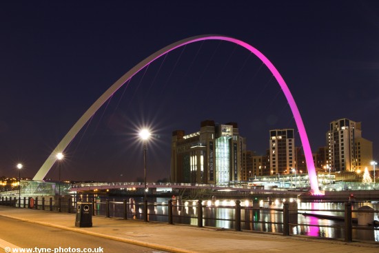 Millennium Bridge seen changing colour from purple to red.