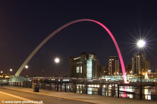 Millennium Bridge seen changing colour from purple to red.