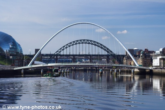 Small barge passing under the Millennium Bridge shortly before it started to open.
