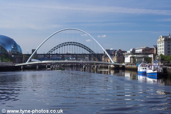 Small barge passing under the Millennium Bridge shortly before it started to open.
