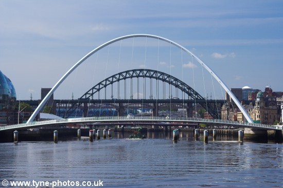 Small barge passing under the Millennium Bridge shortly before it started to open.