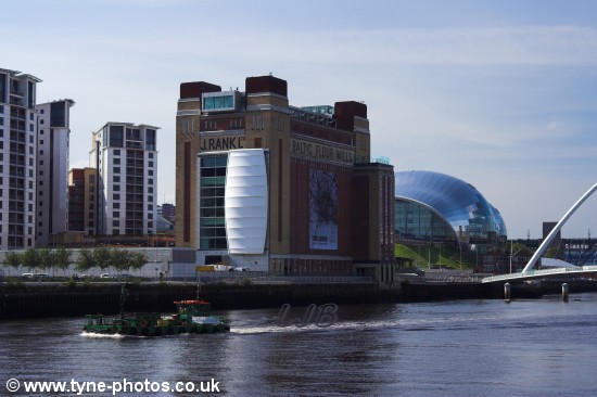 Small barge returning down the river.