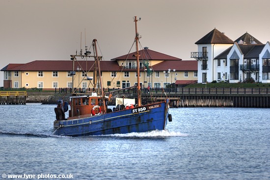 Fishing boat Kinloch sailing up the RiverTyne at sunset.