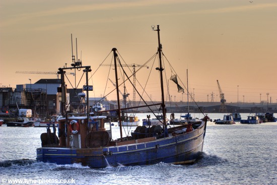 Fishing boat Kinloch sailing up the RiverTyne at sunset.
