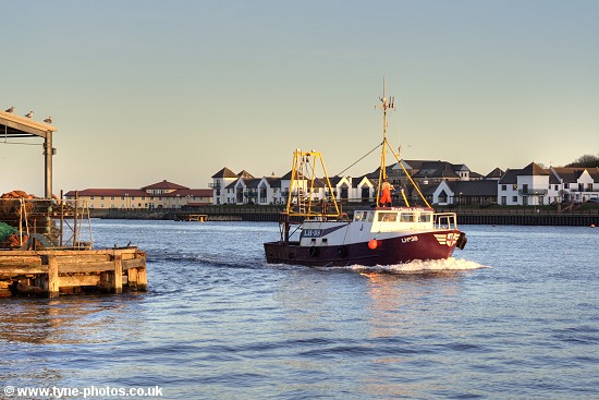 Fishing boat Barbara Anne sailing up the RiverTyne at sunset.