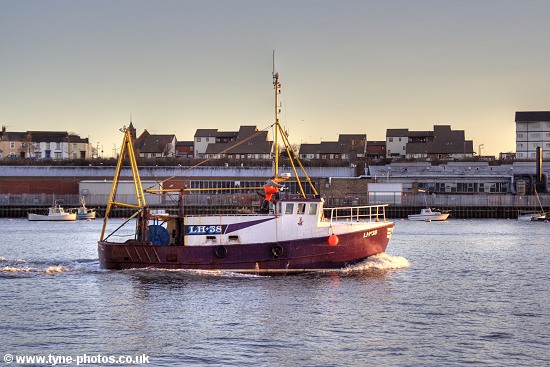 Fishing boat Barbara Anne sailing up the RiverTyne at sunset.