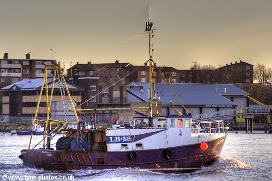Fishing boat Barbara Anne sailing up the RiverTyne at sunset.