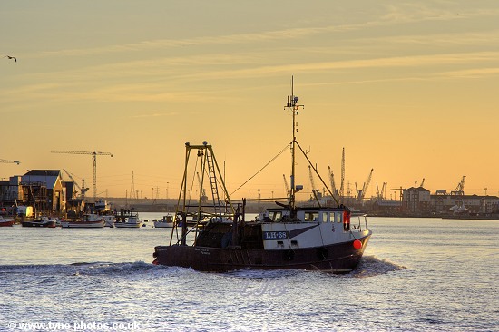 Fishing boat Barbara Anne sailing up the RiverTyne at sunset.