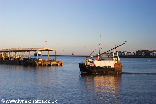 Fishing boat approaching North Shields Fish Quay.
