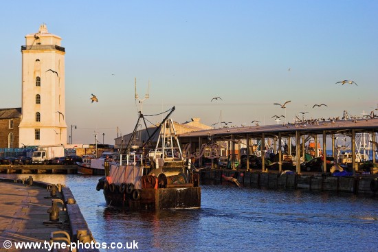 Fishing boat approaching North Shields Fish Quay.