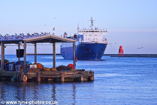 Car carrier City of Barcelona arriving in the River Tyne and passing North Shields Fish Quay.