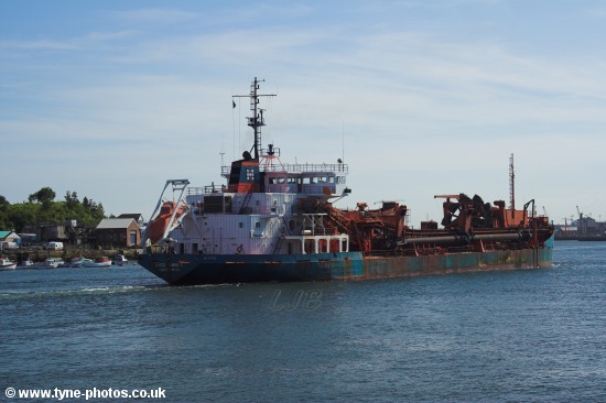 Dredger Arco Humber passing North Shields Fish Quay.