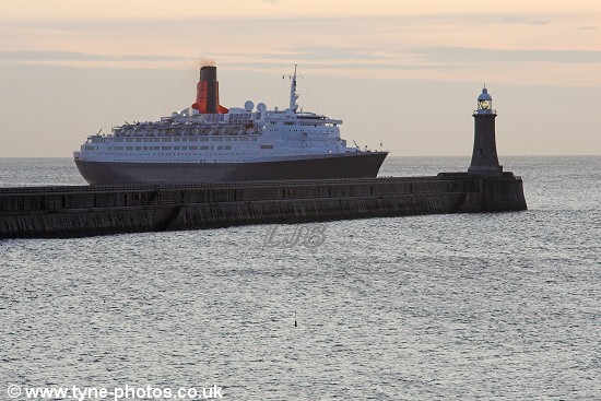 The QE2 approaching Tynemouth Lighthouse.