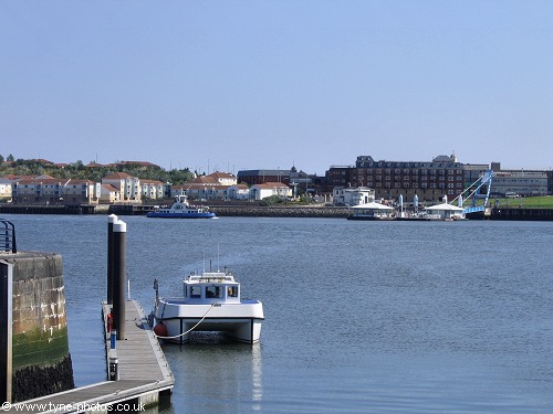 Boat moored at the marina entrance.