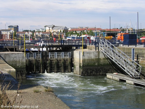 Water level lowering through outer gates.
