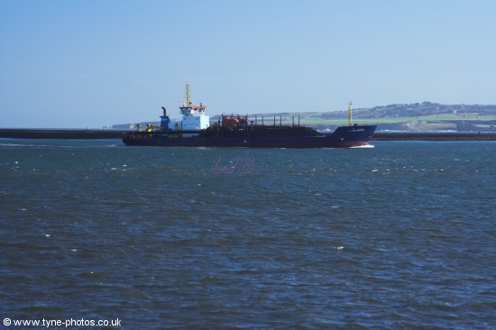 The Dredger UKD Bluefin returning to the River Tyne past South Shields Pier and Lighthouse.
