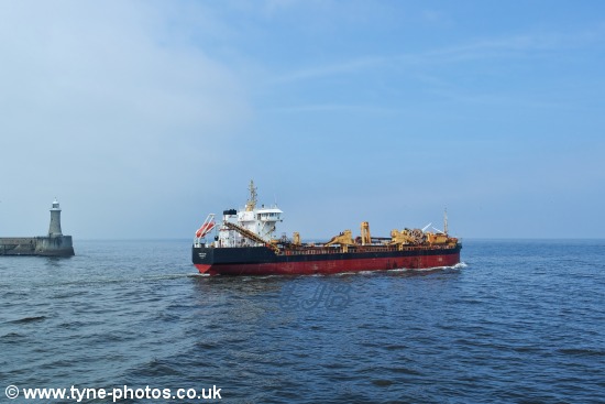 Dredger Sand Falcon leaving the River Tyne, past Tynemouth Pier.
