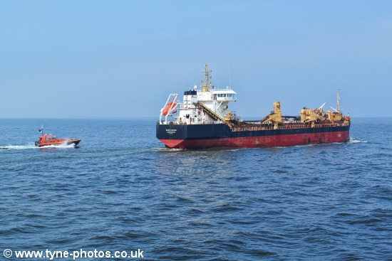 Dredger Sand Falcon leaving the River Tyne, past Tynemouth Pier.