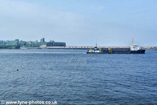 Dredger UKD Marlin working at the mouth of the River Tyne.