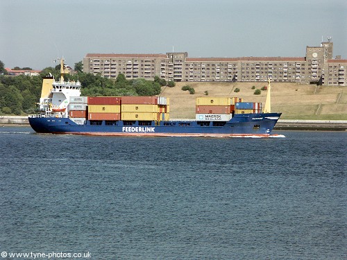 A container ship sailing out of the River Tyne.