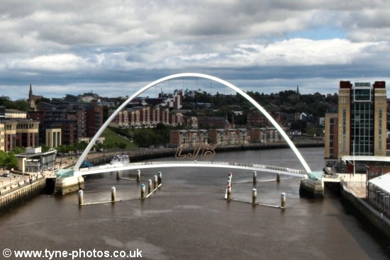 View of the Millennium Bridge on a cloudier day.
