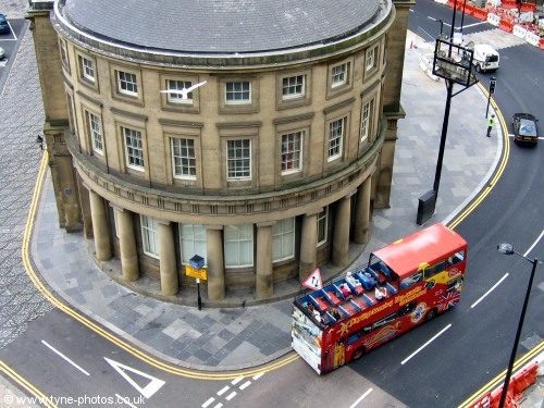 An open top bus on a tour of the City.