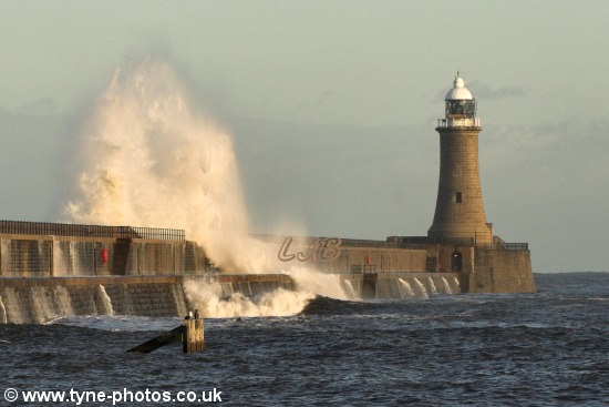 Waves breaking over Tynemouth Pier.