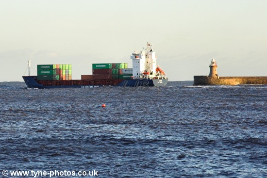 Feederlink cargo ship passing South Shields Pier and Lighthouse.