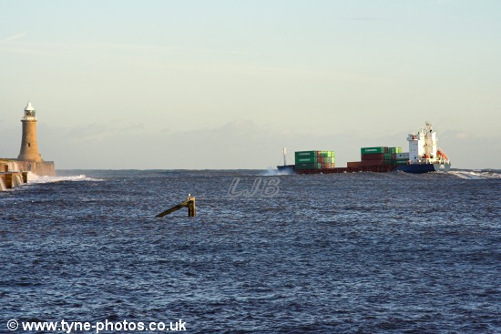 Between the piers and pitching in the swell.