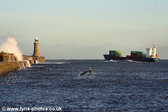 Between the piers and pitching in the swell.
