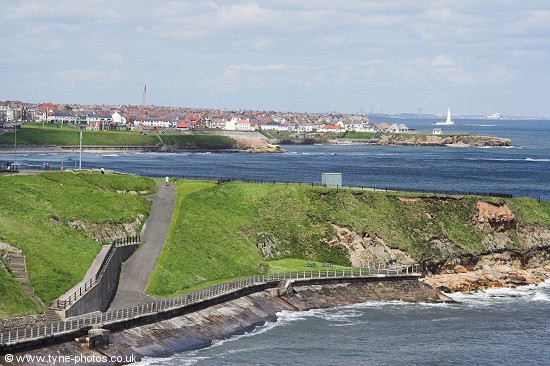 View along the coast to Cullercoats and beyond, St mary's Island Lighhouse. In the far distance is Alcan power Station at Lynemouth.